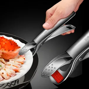 Stainless steel anti-scald dish clip with silicone tips, kitchen tool for hot plates and bowls.