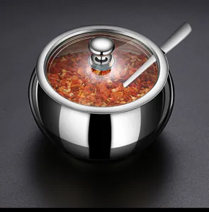 High-quality stainless steel seasoning jar detail with transparent glass lid and spoon
