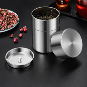 Stainless steel tea canister with double lid airtight design for food dry goods storage.