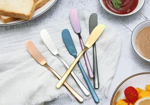 Colorful stainless steel butter spreader knives for jam, cheese, and baking dessert use.