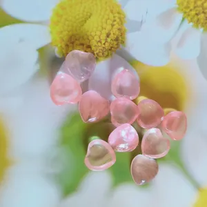 Close-up detail shot of pink heart-shaped crystal cabochons, perfect for DIY jewelry making accessories.