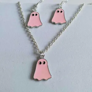 Detail view of cute pink ghost necklace and earrings jewelry set for Halloween style
