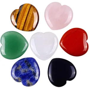 Detailed close-up of polished natural crystal heart stones, showing gemstone textures and smooth finish.