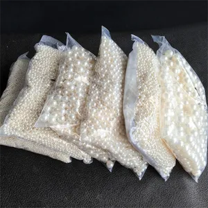 ABS faux pearl loose beads in various sizes, packaged in clear bags for DIY jewelry.