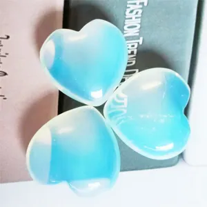 Blue crystal heart-shaped ornament, smooth and translucent detail view for home decor.