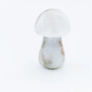 Detailed close-up shot of a natural crystal stone carved mushroom figurine, exquisite mini decor.