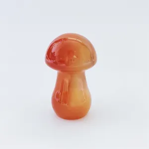 Natural red agate crystal mushroom ornament detail view, polished gemstone craft decor.