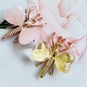 Natural stone butterfly crystal ornament detail view, heart shaped crystal wings metal craft decor.
