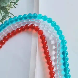 Close-up detail of colorful glass round beads set, perfect for DIY handmade jewelry crafting.