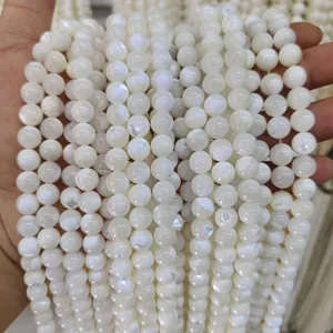Detail shot of white mother of pearl shell round beads, perfect for DIY handmade jewelry.
