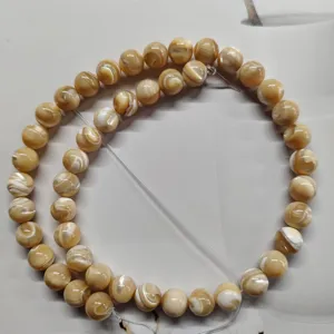 Natural shell loose beads detail view, perfect for DIY jewelry making and handmade crafts.