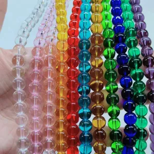 Colorful glass round beads for DIY handmade jewelry crafting, vibrant loose bead strands.