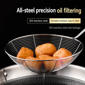 Stainless steel kitchen spider skimmer strainer ladle for fried food and dumplings.