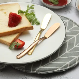 Stainless steel butter knife set, golden bread spreader and jam knife for kitchen use.