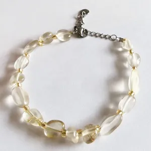 Natural irregular crystal gemstone bracelet detail view, transparent quartz women jewelry accessory