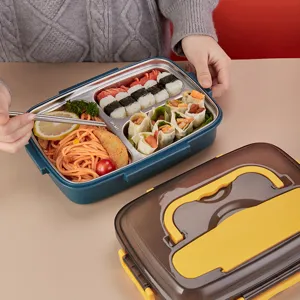 Detailansicht der 304 Edelstahl Bento Brotdose mit mehreren Fächern und praktischem Besteck.