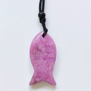 Natural crystal fish pendant detail shot, showing the unique pink gemstone carving and cord.