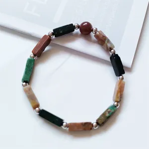 Detailed shot of multi-color natural mineral rectangular block gemstone bracelet with metal beads.
