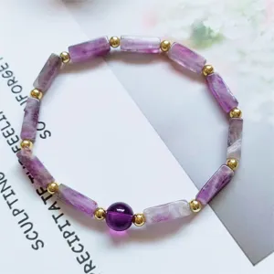 Natural amethyst bar bead bracelet with gold spacer beads, delicate fashion crystal jewelry detail.