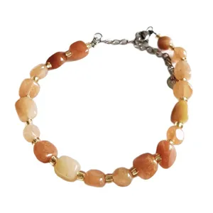 Natural irregular crystal stone bracelet with gold spacers and adjustable chain for women.