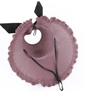 Knit empty top sun hat detail, wide brim summer visor with black bow and chin strap.