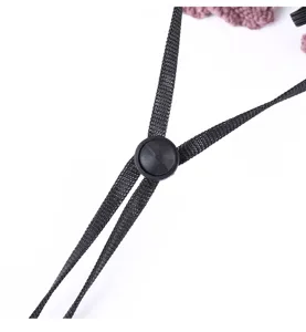 Close-up detail of adjustable chin strap and black plastic cord lock on sun hat, durable.
