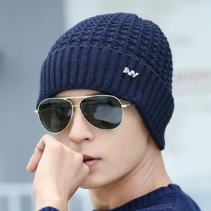 Close-up view of the cozy knitted winter beanie featuring textured pattern and metallic accent.