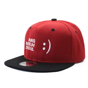 Red black flat brim baseball cap detail featuring city embroidery and smiley face.