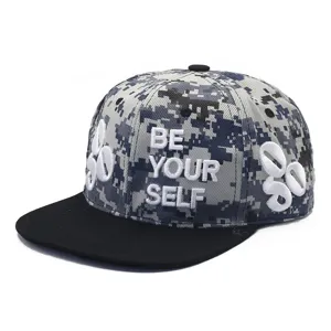 Detailed view of a camouflage snapback cap with "BE YOUR SELF" 3D embroidery.