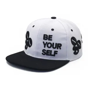 Close-up of 3D 'BE YOUR SELF' embroidery on white and black flat brim baseball cap