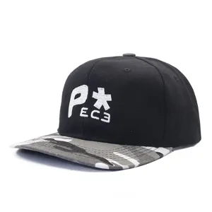 Detailed view of the black hip hop baseball cap with white embroidery and camo flat brim.