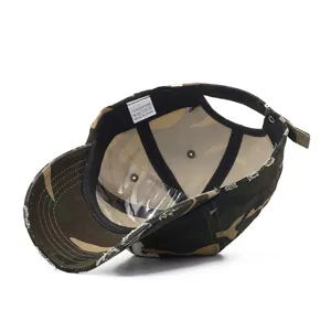Distressed camo baseball cap interior detail showing cotton label and quality craftsmanship.