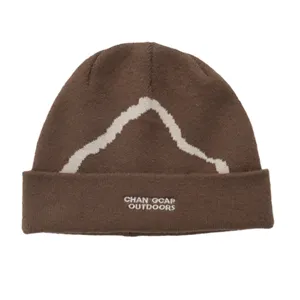 Brown knit beanie featuring a white snow mountain pattern for winter outdoor sports