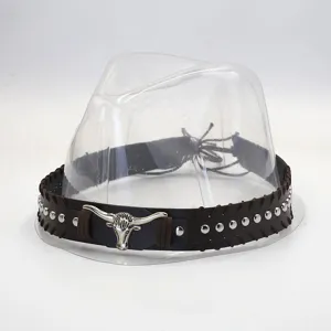 Detailed view of brown leather hat band with vintage metal bull skull and silver studs.