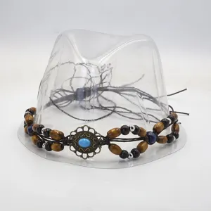 Vintage woven hat band handmade DIY accessories with wooden beads and turquoise detail.