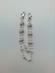 Detailed view of hip hop pant chain with 12mm rhinestone beads and white rose beads
