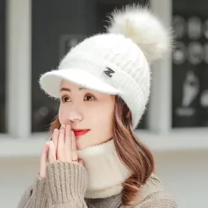 Detailed shot of women's winter thick knit hat with visor, fluffy pom pom, and stylish Z logo.