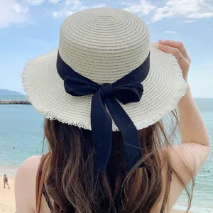Women summer beach straw hat with elegant black ribbon bow, breathable sun protection design.