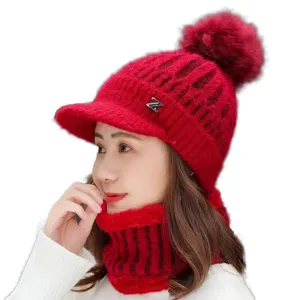Women winter warm knit beanie hat with visor, fluffy pom-pom and fleece neck warmer, red main view