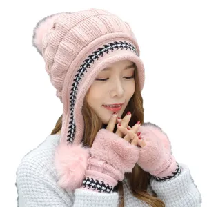 Pink winter knitted hat and fingerless mittens set with pom-poms and cozy ear flaps
