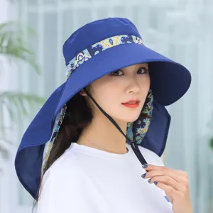 Close-up of women's wide brim sun hat with neck flap and stylish printed lining.