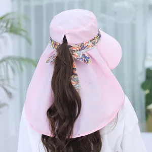 Detailed view of women summer sun protection hat with wide brim and neck flap in pink.