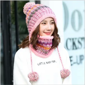 Detailed macro view of the colorful fleece-lined knitted hat with soft pom-poms