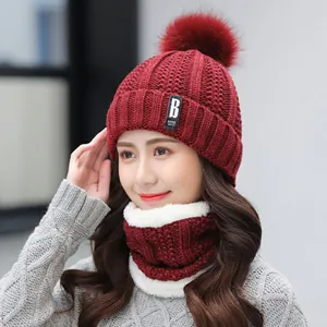 Thick fleece-lined winter knitted beanie and snood set in dark red with cute pom-pom.