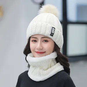 Winter warm knitted beanie hat and scarf set with plush fleece lining and cute pom pom design.