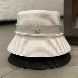 Elegant summer straw bucket hat for women with pearl trim and metal M logo sun cap