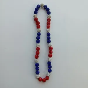 Detailed closeup of the red white and blue rhinestone crystal ball beaded necklace sparkling design.