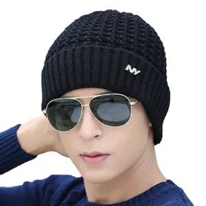 Men's black knitted winter beanie hat with metal NY logo, warm fleece style, fashion winter wear.