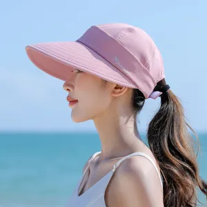 Pink empty top sun visor hat for women, large brim UV protection outdoor beach summer wear.