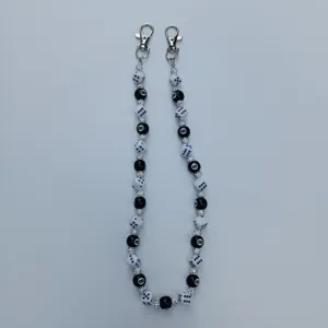 Black and white dice and 8-ball bead pants chain, stylish hip-hop bag strap accessory.